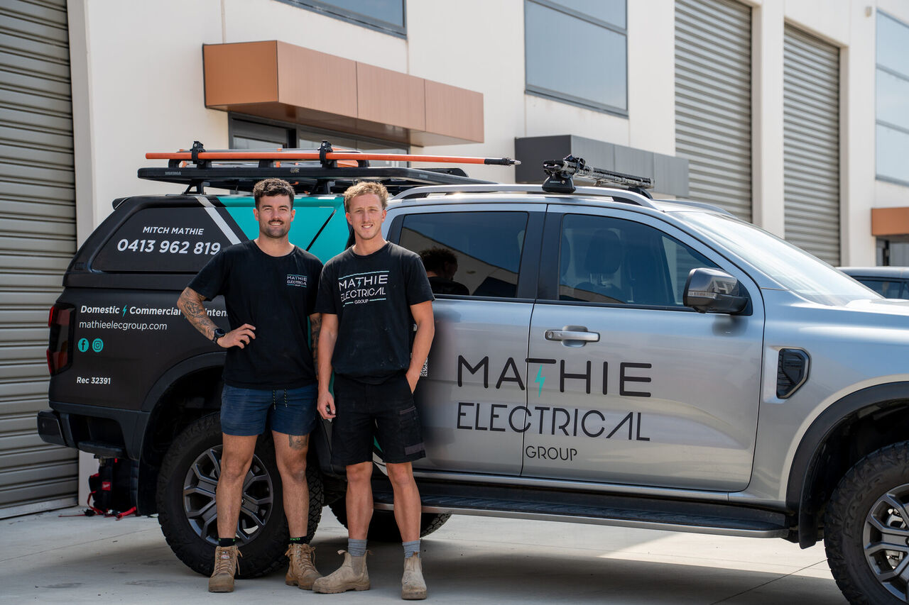 Mitch and Sam from Mathie Electrical Group with the branded work ute in Frankston
